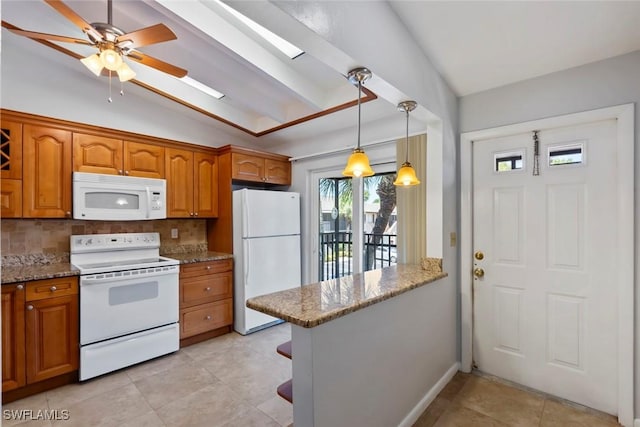 3450 Frosty Way Unit 5210, Naples, FL 34112 - kitchen with white appliances, brown cabinets, decorative backsplash, stone counters, and ceiling fan