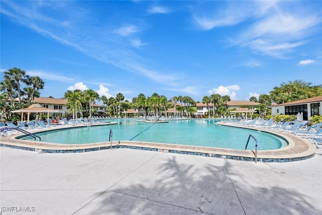 3450 Frosty Way Unit 5210, Naples, FL 34112 - community pool featuring a patio