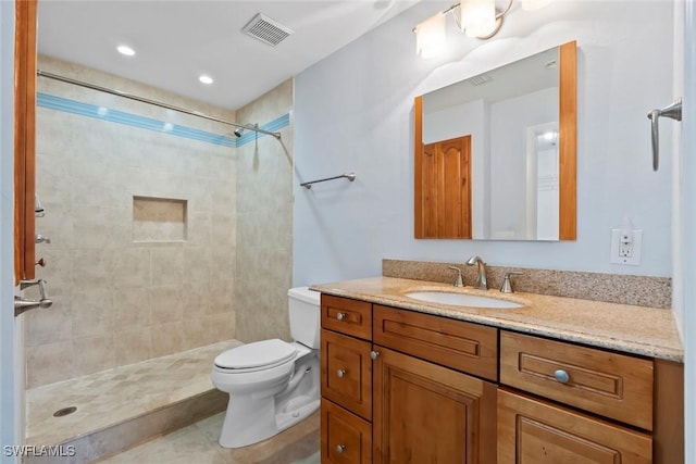 3450 Frosty Way Unit 5210, Naples, FL 34112 - bathroom with toilet, a tile shower, vanity, and tile patterned flooring