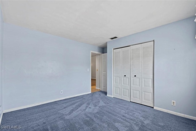 3450 Frosty Way Unit 5210, Naples, FL 34112 - unfurnished bedroom with carpet flooring, baseboards, and a closet