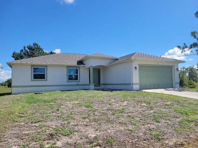 ranch-style house featuring stucco siding, a garage, concrete driveway, and a front yard