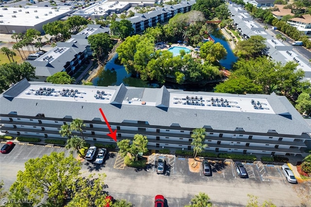 600 Neapolitan Way Unit 153, Naples, FL 34103 - drone / aerial view of a pool area