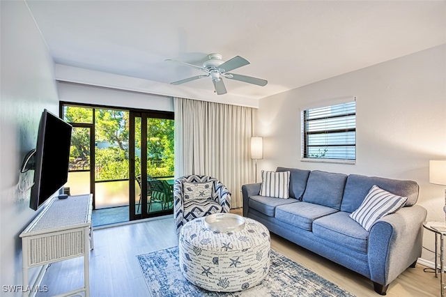 600 Neapolitan Way Unit 153, Naples, FL 34103 - living area with plenty of natural light, wood finished floors, and ceiling fan