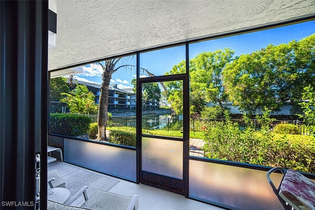 600 Neapolitan Way Unit 153, Naples, FL 34103 - entryway with expansive windows and a water view
