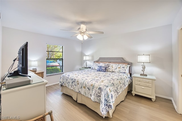 600 Neapolitan Way Unit 153, Naples, FL 34103 - bedroom featuring light wood-type flooring and ceiling fan