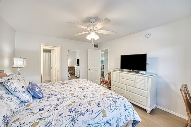 600 Neapolitan Way Unit 153, Naples, FL 34103 - bedroom featuring light wood-type flooring and ceiling fan