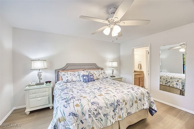 600 Neapolitan Way Unit 153, Naples, FL 34103 - bedroom featuring light wood-type flooring, ceiling fan, and ensuite bath