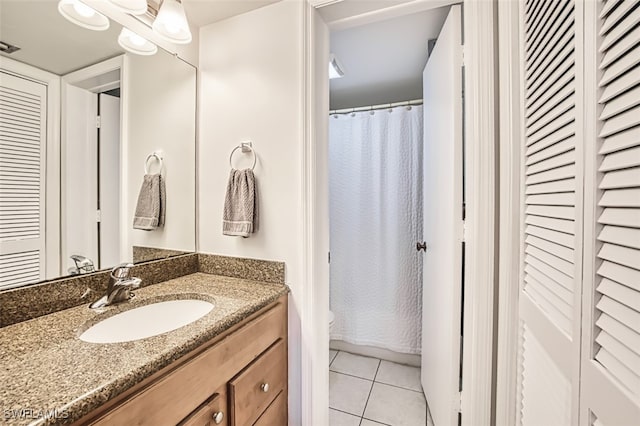 600 Neapolitan Way Unit 153, Naples, FL 34103 - full bath with vanity, tile patterned flooring, and a closet