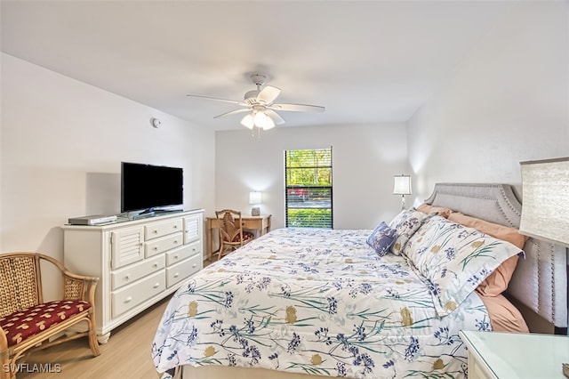 600 Neapolitan Way Unit 153, Naples, FL 34103 - bedroom with light wood finished floors and a ceiling fan