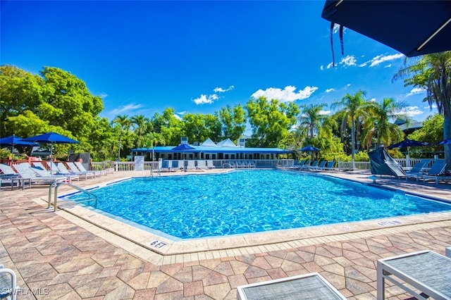 600 Neapolitan Way Unit 153, Naples, FL 34103 - community pool with a patio area