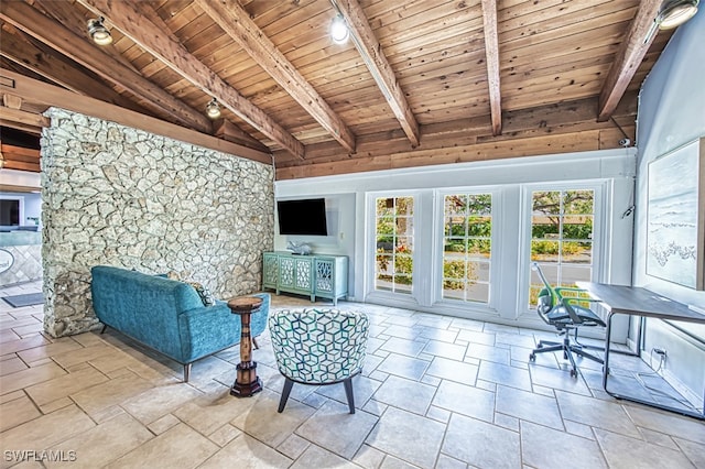 600 Neapolitan Way Unit 153, Naples, FL 34103 - sitting room featuring wooden ceiling, track lighting, and stone finish floors