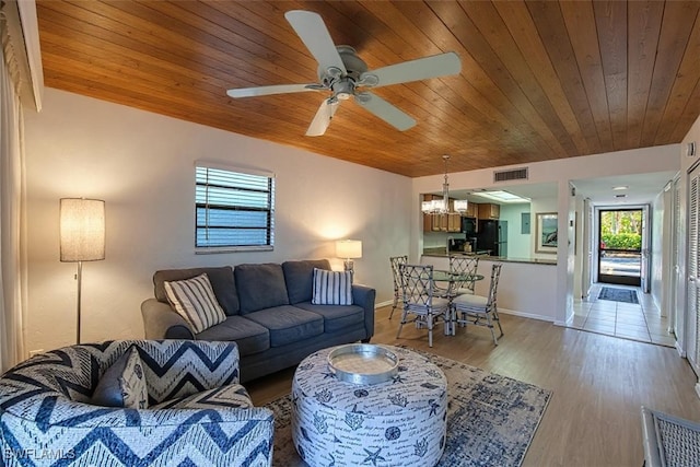 600 Neapolitan Way Unit 153, Naples, FL 34103 - living area with a chandelier, wooden ceiling, light wood-style floors, and a ceiling fan