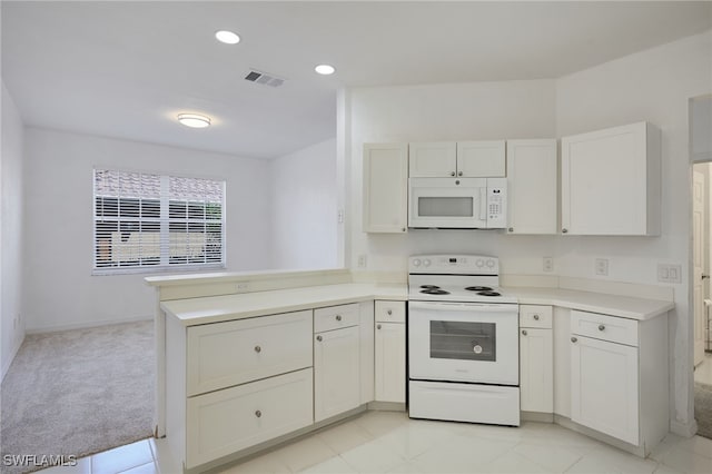 14541 Daffodil Dr Unit 1702, Fort Myers, FL 33919 - kitchen featuring white appliances, a peninsula, light countertops, recessed lighting, and white cabinets