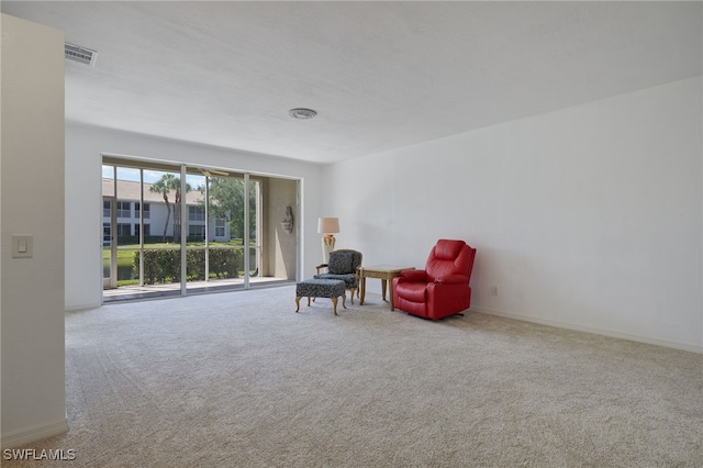 14541 Daffodil Dr Unit 1702, Fort Myers, FL 33919 - living area with carpet flooring and baseboards