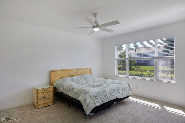 14541 Daffodil Dr Unit 1702, Fort Myers, FL 33919 - bedroom with light colored carpet, ceiling fan, and baseboards