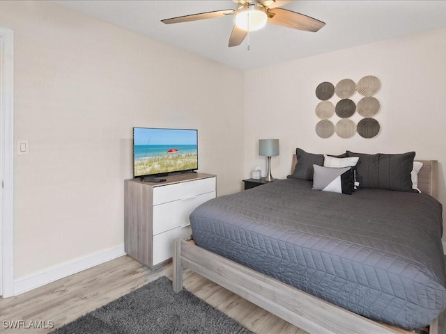 698 99th Ave N, Naples, FL 34108 - bedroom featuring wood finished floors, baseboards, and ceiling fan