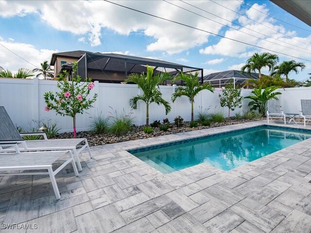 698 99th Ave N, Naples, FL 34108 - view of pool featuring a patio and a fenced backyard