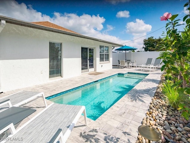 698 99th Ave N, Naples, FL 34108 - view of pool featuring a patio and fence