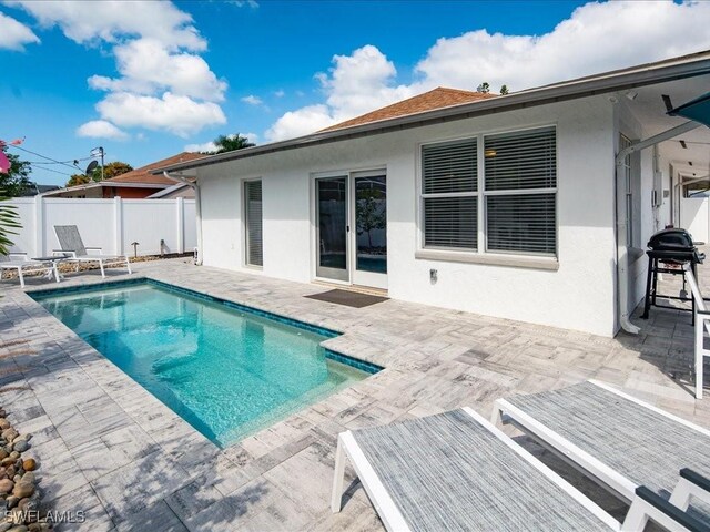 698 99th Ave N, Naples, FL 34108 - view of pool with a patio, fence, and french doors
