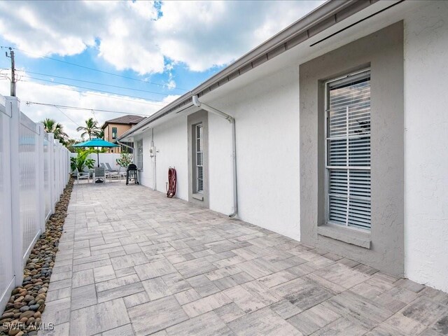 698 99th Ave N, Naples, FL 34108 - view of patio / terrace featuring a fenced backyard