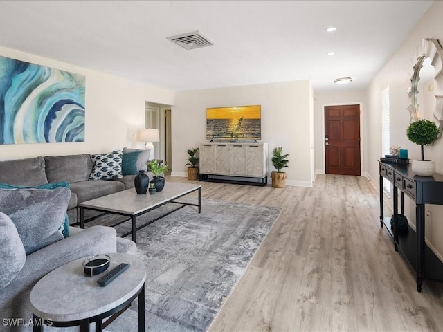 698 99th Ave N, Naples, FL 34108 - living area featuring wood finished floors and baseboards