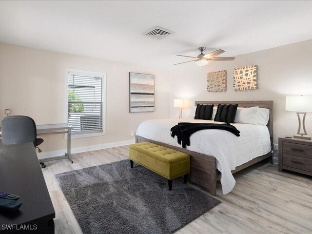 698 99th Ave N, Naples, FL 34108 - bedroom featuring light wood finished floors, baseboards, and a ceiling fan