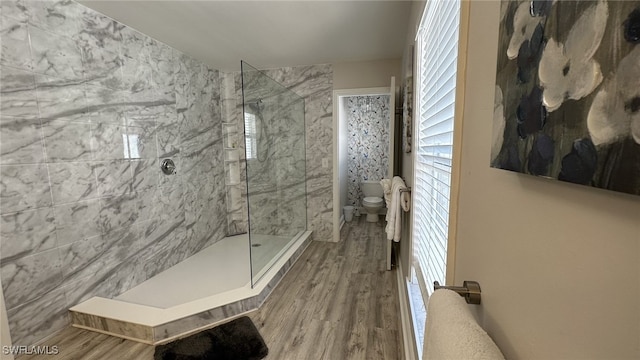 698 99th Ave N, Naples, FL 34108 - full bath with toilet, a walk in shower, wood finished floors, and healthy amount of natural light
