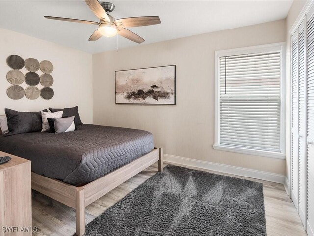 698 99th Ave N, Naples, FL 34108 - bedroom featuring light wood-type flooring, baseboards, and a ceiling fan