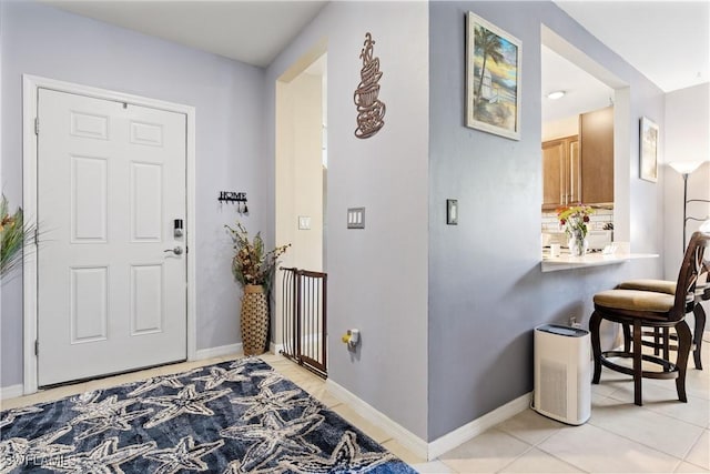 18 SW 19th Ter, Cape Coral, FL 33991 - foyer with baseboards and light tile patterned floors