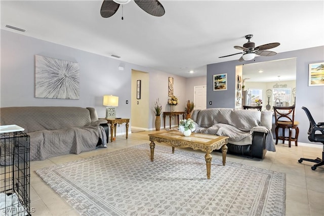 18 SW 19th Ter, Cape Coral, FL 33991 - tiled living room featuring ceiling fan and baseboards
