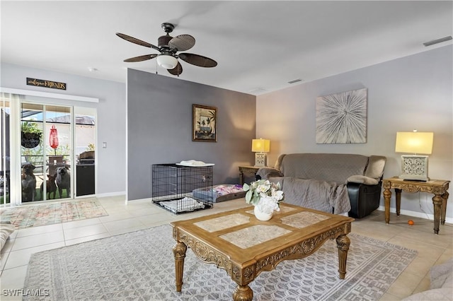 18 SW 19th Ter, Cape Coral, FL 33991 - living area with light tile patterned floors, a ceiling fan, and baseboards