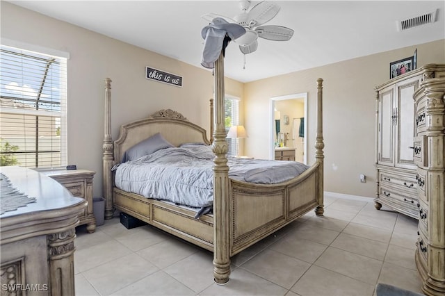 18 SW 19th Ter, Cape Coral, FL 33991 - bedroom with light tile patterned floors, baseboards, a ceiling fan, and ensuite bath
