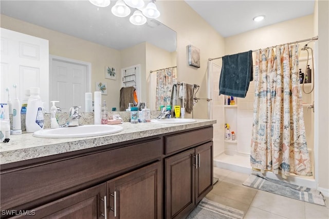 18 SW 19th Ter, Cape Coral, FL 33991 - bathroom with a stall shower, tile patterned flooring, and double vanity