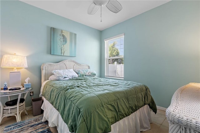 18 SW 19th Ter, Cape Coral, FL 33991 - tiled bedroom with baseboards and ceiling fan