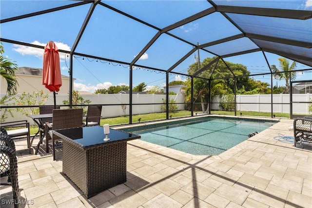 18 SW 19th Ter, Cape Coral, FL 33991 - view of pool featuring a patio area, a fenced backyard, and a lanai