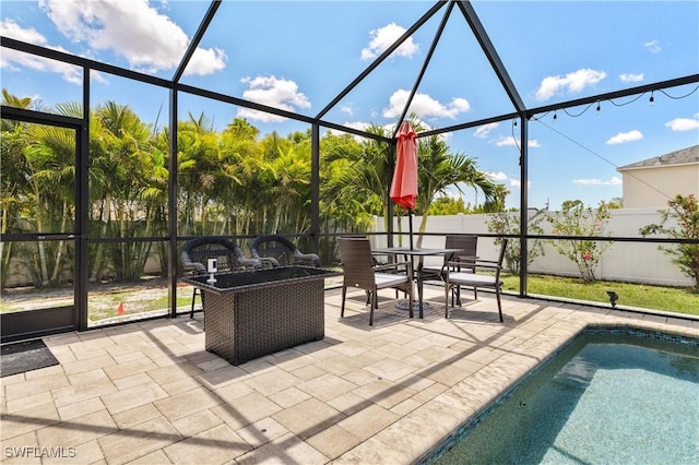 18 SW 19th Ter, Cape Coral, FL 33991 - view of patio featuring glass enclosure, a fenced backyard, and outdoor dining space