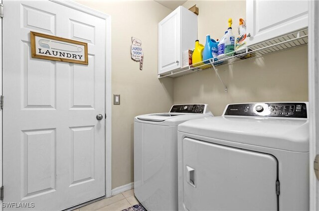 18 SW 19th Ter, Cape Coral, FL 33991 - laundry area with cabinet space, independent washer and dryer, light tile patterned flooring, and baseboards