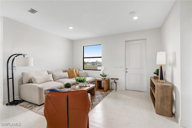 9018 W Castle Cir, Labelle, FL 33935 - living room with recessed lighting, light marble finish floors, and baseboards