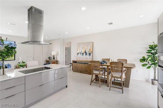 9018 W Castle Cir, Labelle, FL 33935 - kitchen with island exhaust hood, black electric stovetop, modern cabinets, gray cabinetry, and recessed lighting