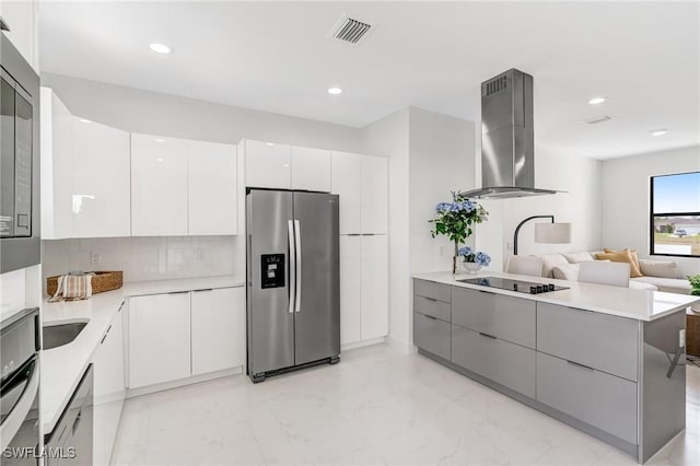 9018 W Castle Cir, Labelle, FL 33935 - kitchen featuring stainless steel appliances, ventilation hood, modern cabinets, tasteful backsplash, and recessed lighting