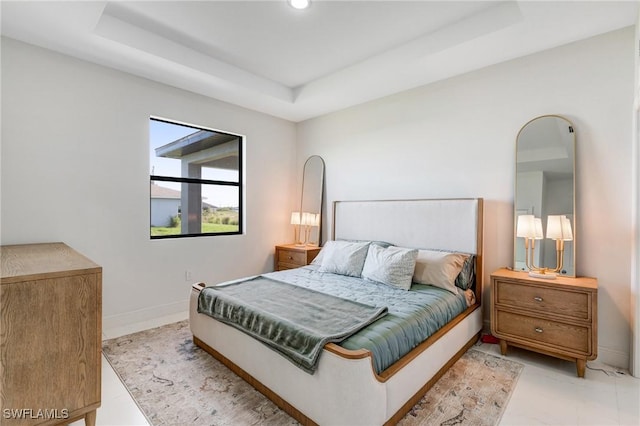 9018 W Castle Cir, Labelle, FL 33935 - bedroom featuring a raised ceiling and baseboards