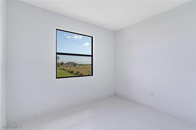 9018 W Castle Cir, Labelle, FL 33935 - unfurnished room with light marble finish flooring and baseboards