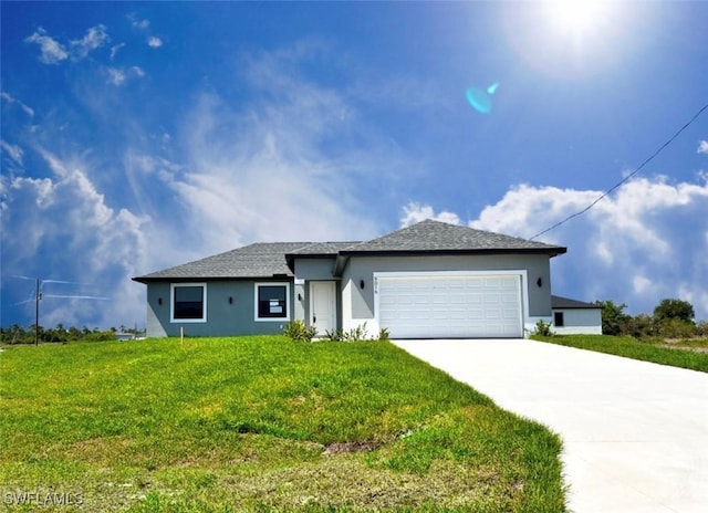 9016 E Justice Cir, Labelle, FL 33935 - ranch-style home featuring driveway, an attached garage, stucco siding, and a front lawn