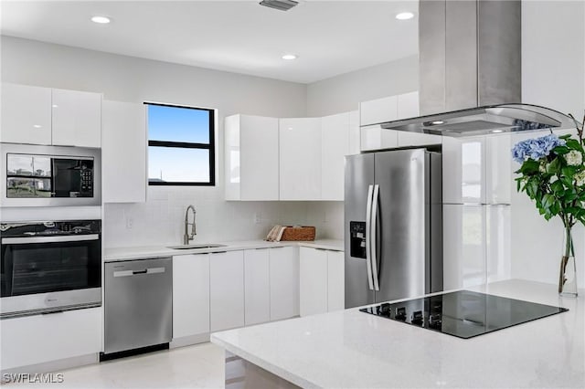 8106 Olive Ct, Labelle, FL 33935 - kitchen featuring island range hood, appliances with stainless steel finishes, a sink, modern cabinets, and white cabinets