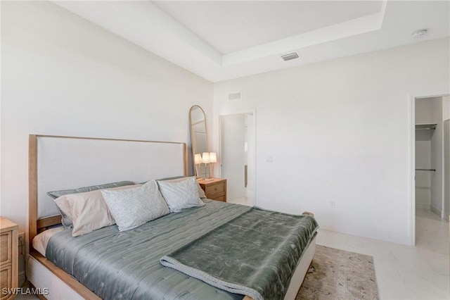 8106 Olive Ct, Labelle, FL 33935 - bedroom featuring light marble finish floors, a tray ceiling, and baseboards