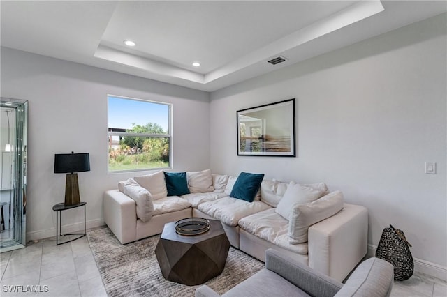 2008 Hercules Rd, Labelle, FL 33935 - living room featuring a tray ceiling, baseboards, and recessed lighting