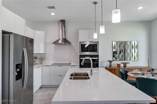 2008 Hercules Rd, Labelle, FL 33935 - kitchen featuring stainless steel fridge, wall oven, wall chimney exhaust hood, modern cabinets, and recessed lighting