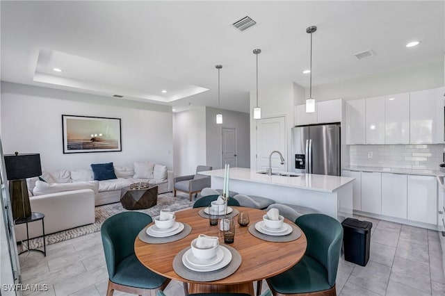 2008 Hercules Rd, Labelle, FL 33935 - dining room featuring recessed lighting, light tile patterned floors, and a tray ceiling