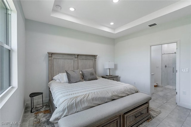 2008 Hercules Rd, Labelle, FL 33935 - bedroom featuring recessed lighting, baseboards, ensuite bath, a tray ceiling, and multiple windows