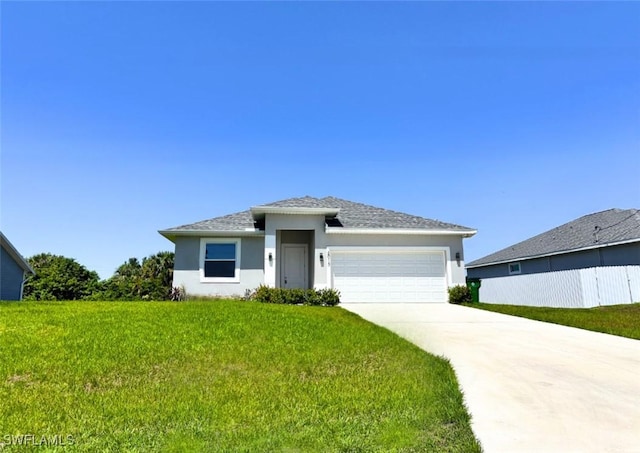 2013 Inglewood Cir, Labelle, FL 33935 - prairie-style house with stucco siding, an attached garage, a front lawn, and driveway